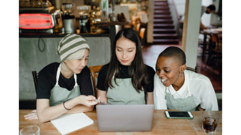 coffee-shop-owner-looks-at-her-business-online