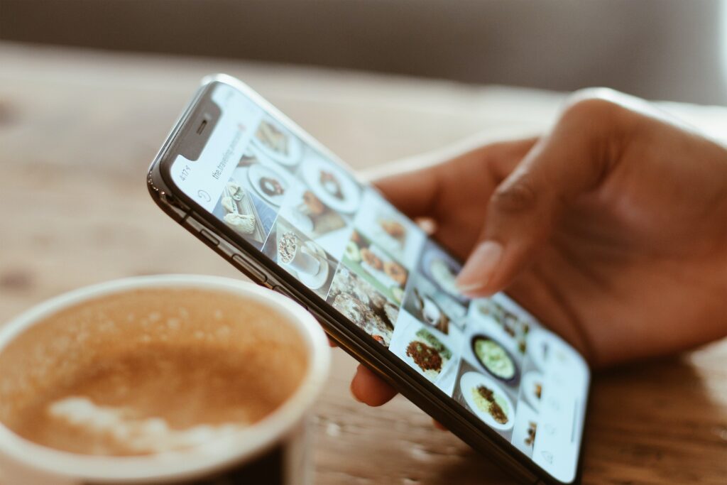 A person using instagram at a coffee shop