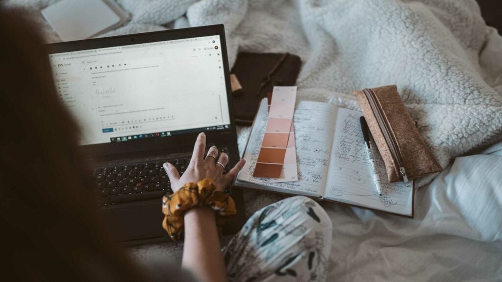 A woman sitting on her bed checking her email and comparing colour samples

Photo by Taryn Elliott from Pexels