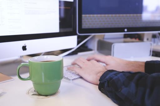 A person creating an email list on a Mac