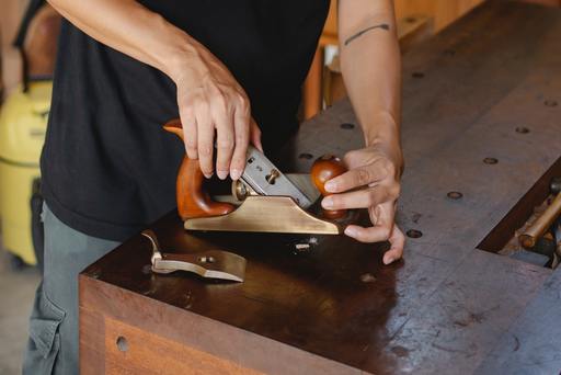 A craftsman using a knife for review