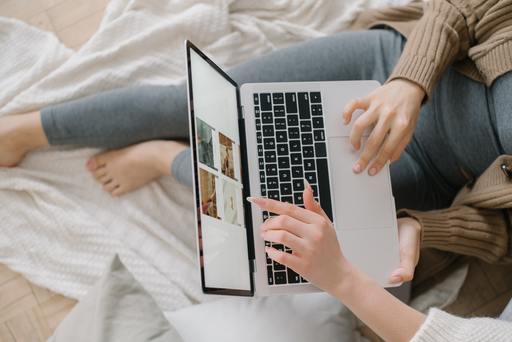 A person using a laptop on an e-commerce page.