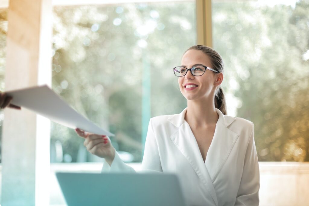 A businesswoman receiving a grant application