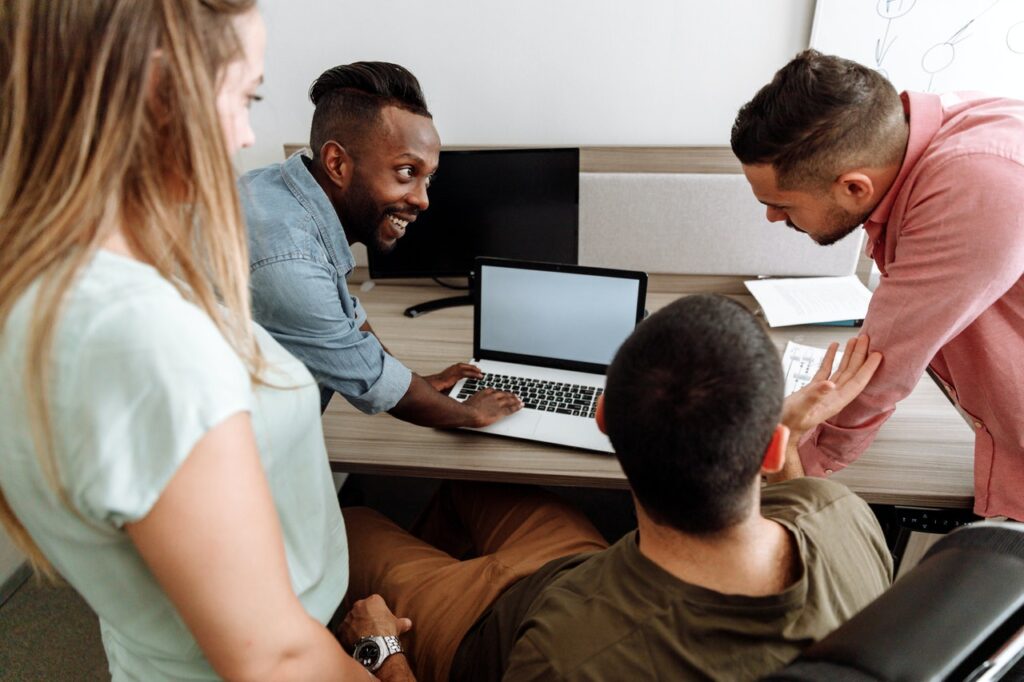 Group of people evaluating small business grants at work