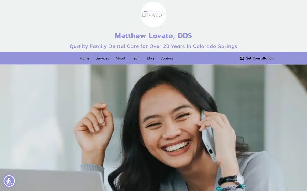 Matthew Lovato DDS website with patient-on-phone lifestyle portrait and Colorado Springs anchor