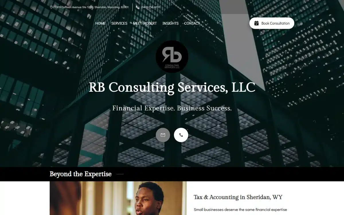 RB Consulting Services accounting website with a cinematic dark-blue skyscraper hero and a centered RB monogram