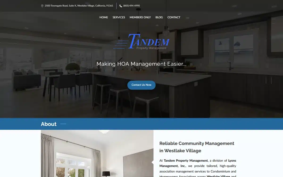 Tandem Property Management website with moody dark kitchen interior and script logo