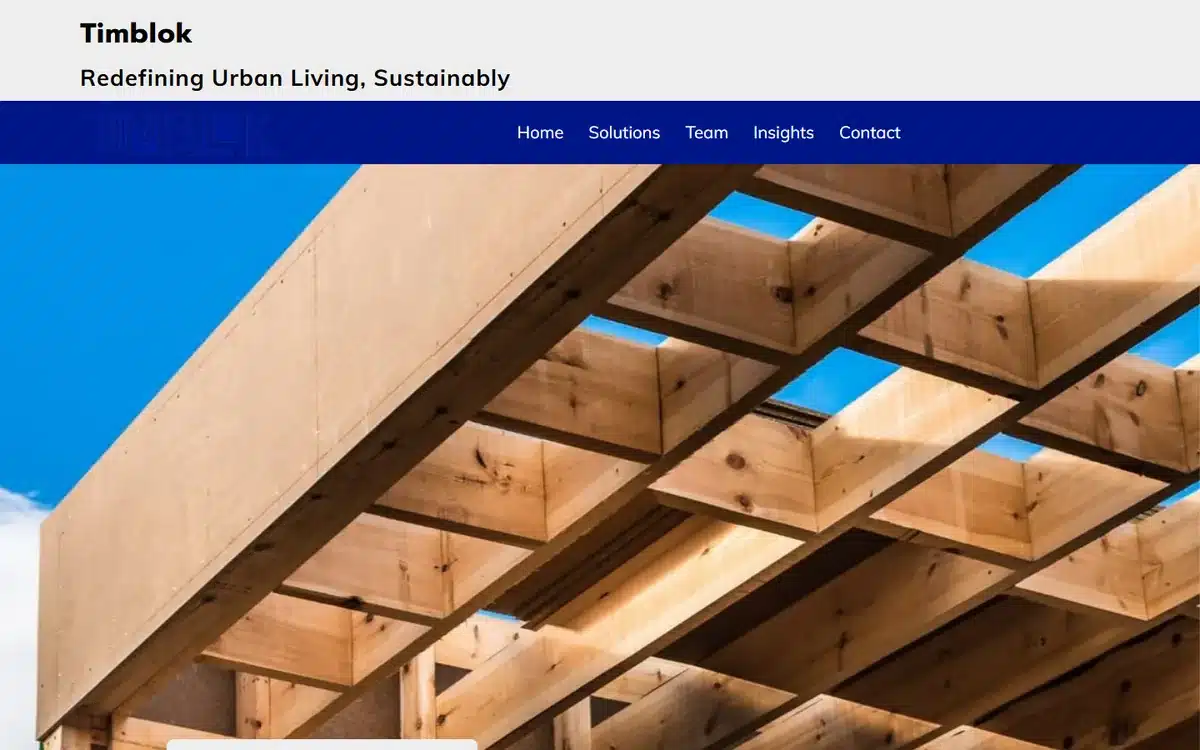 Timblok sustainable property developer website with architectural timber-beam ceiling hero