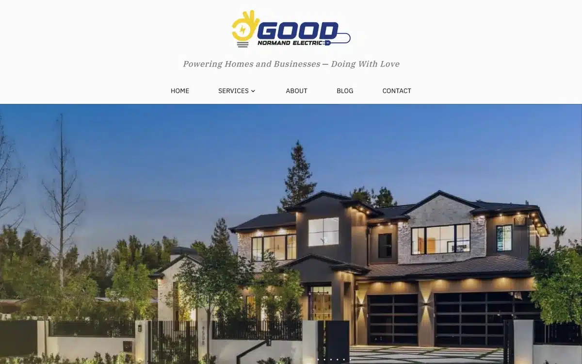 Good Normand Electric website homepage with the tagline between the logo and the navigation above a night-lit home slider