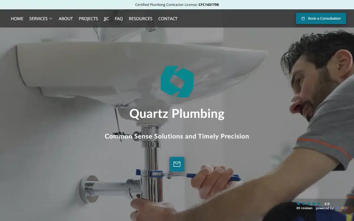 Quartz Plumbing website homepage with contractor licence number printed in a slim bar above the navigation